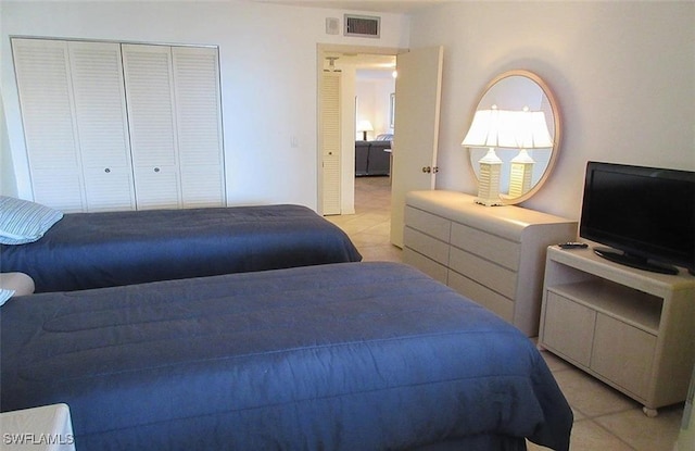 4265 Bay Beach Ln Unit 524, Fort Myers Beach, FL 33931 - bedroom with a closet and light tile patterned flooring