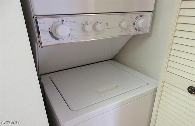 4265 Bay Beach Ln Unit 524, Fort Myers Beach, FL 33931 - washroom featuring stacked washing machine and dryer