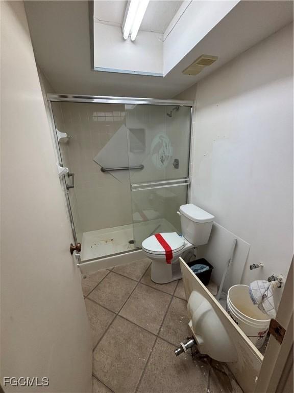 4265 Bay Beach Ln Unit 524, Fort Myers Beach, FL 33931 - full bathroom featuring a stall shower and tile patterned floors