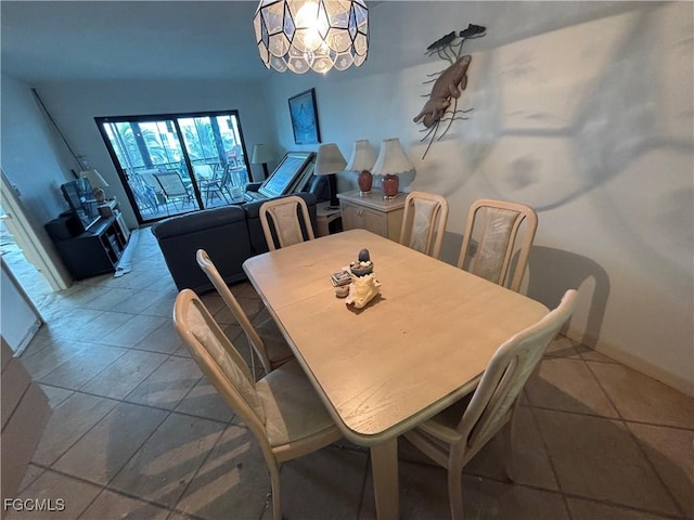 4265 Bay Beach Ln Unit 524, Fort Myers Beach, FL 33931 - tiled dining area featuring a chandelier and baseboards