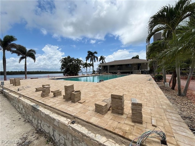 4265 Bay Beach Ln Unit 524, Fort Myers Beach, FL 33931 - community pool with a patio and a water view