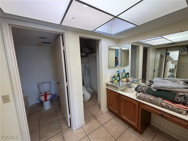 4265 Bay Beach Ln Unit 524, Fort Myers Beach, FL 33931 - bathroom featuring vanity, tile patterned flooring, and a spacious closet