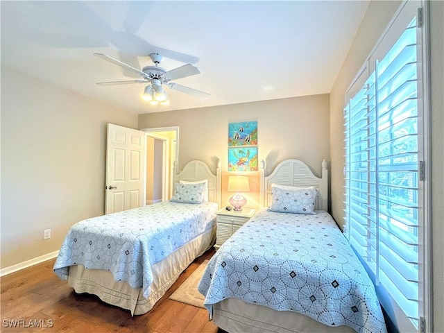 7066 Barrington Cir Unit 201, Naples, FL 34108 - bedroom featuring wood finished floors and a ceiling fan