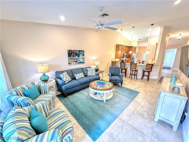 7066 Barrington Cir Unit 201, Naples, FL 34108 - living area featuring a ceiling fan, lofted ceiling, and light tile patterned floors
