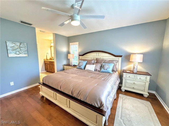 7066 Barrington Cir Unit 201, Naples, FL 34108 - bedroom with dark wood finished floors, ensuite bathroom, and ceiling fan