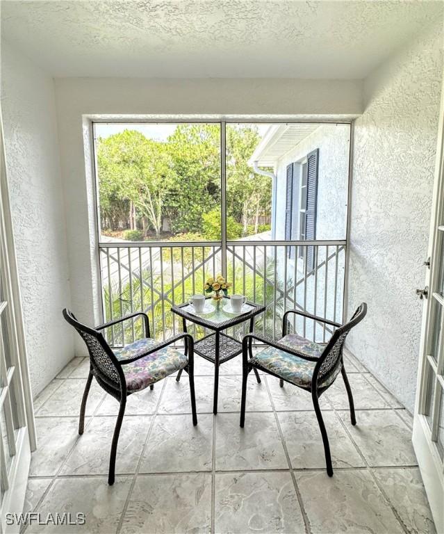 7066 Barrington Cir Unit 201, Naples, FL 34108 - view of sunroom / solarium