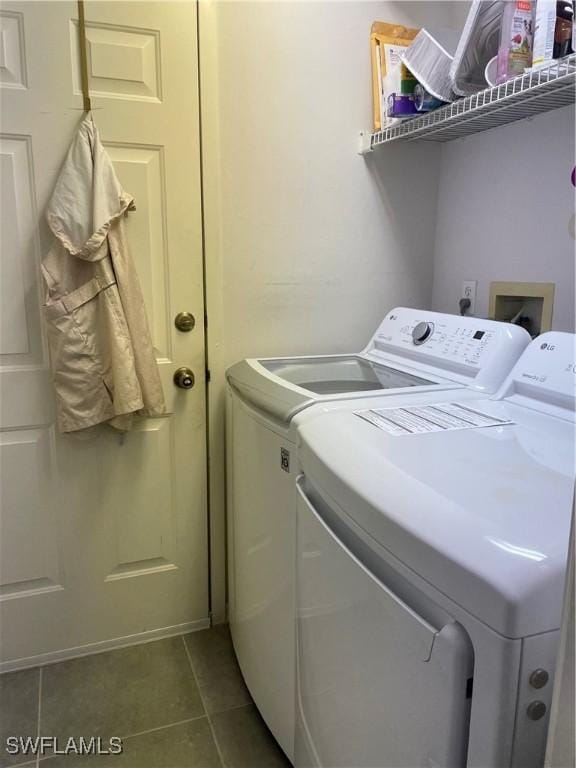 3620 Stone Way, Estero, FL 33928 - washroom with separate washer and dryer and tile patterned flooring