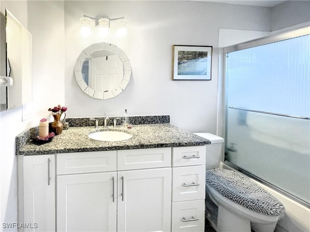 3620 Stone Way, Estero, FL 33928 - bathroom featuring vanity and combined bath / shower with glass door