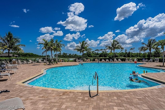 20050 Fiddlewood Ave, North Fort Myers, FL 33917 - community pool featuring a patio area