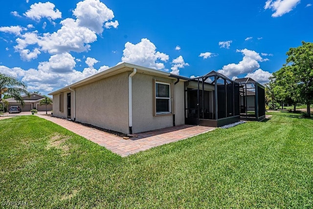 20050 Fiddlewood Ave, North Fort Myers, FL 33917 - view of home's exterior featuring stucco siding and a lawn