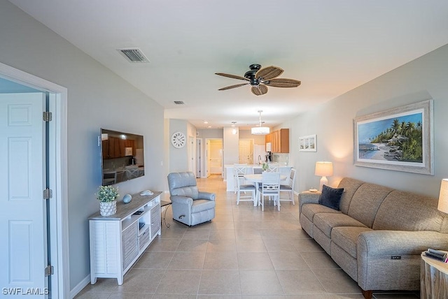 20050 Fiddlewood Ave, North Fort Myers, FL 33917 - living room with a ceiling fan and light tile patterned floors