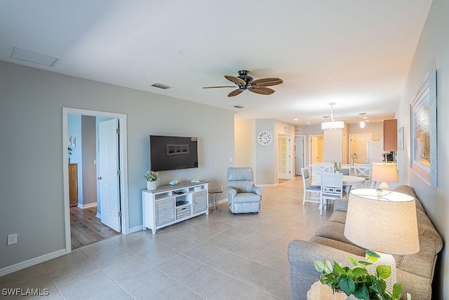 20050 Fiddlewood Ave, North Fort Myers, FL 33917 - living area featuring light tile patterned floors and ceiling fan