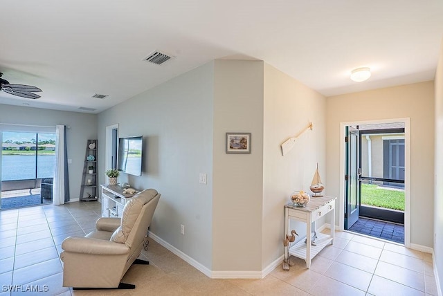 20050 Fiddlewood Ave, North Fort Myers, FL 33917 - foyer entrance with a ceiling fan and light tile patterned floors