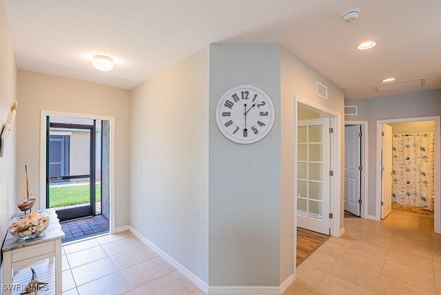 20050 Fiddlewood Ave, North Fort Myers, FL 33917 - entryway with light tile patterned floors and recessed lighting