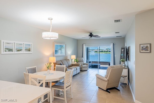20050 Fiddlewood Ave, North Fort Myers, FL 33917 - dining space featuring light tile patterned flooring and a ceiling fan