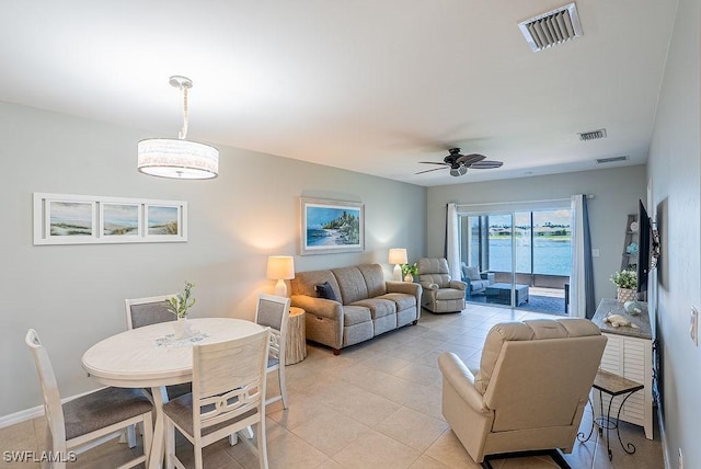 20050 Fiddlewood Ave, North Fort Myers, FL 33917 - living room with ceiling fan and light tile patterned floors