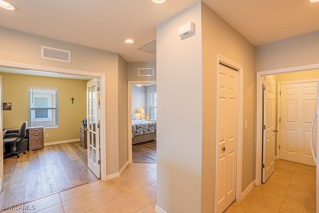 20050 Fiddlewood Ave, North Fort Myers, FL 33917 - corridor featuring light tile patterned floors, an office area, recessed lighting, and french doors