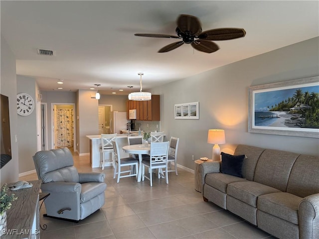 20050 Fiddlewood Ave, North Fort Myers, FL 33917 - living area with light tile patterned floors, a ceiling fan, and recessed lighting