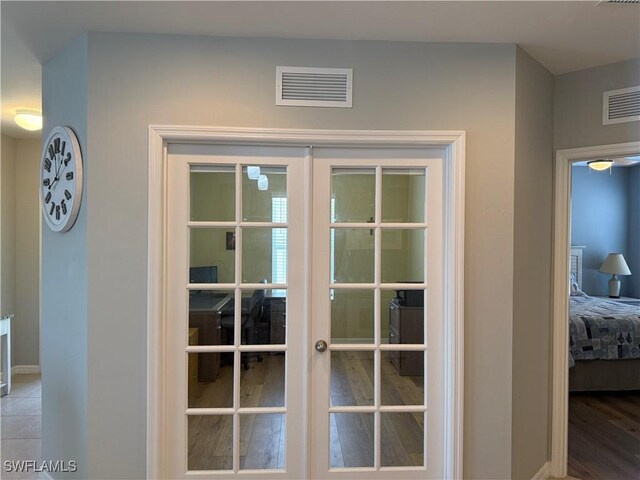20050 Fiddlewood Ave, North Fort Myers, FL 33917 - bedroom / living area view of french doors and baseboards