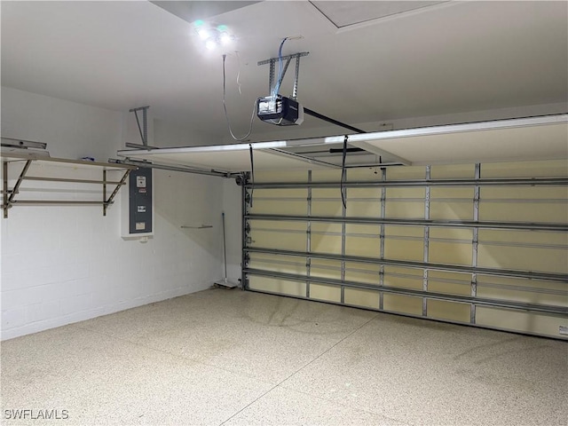 20050 Fiddlewood Ave, North Fort Myers, FL 33917 - garage with a garage door opener, electric panel, and concrete block wall