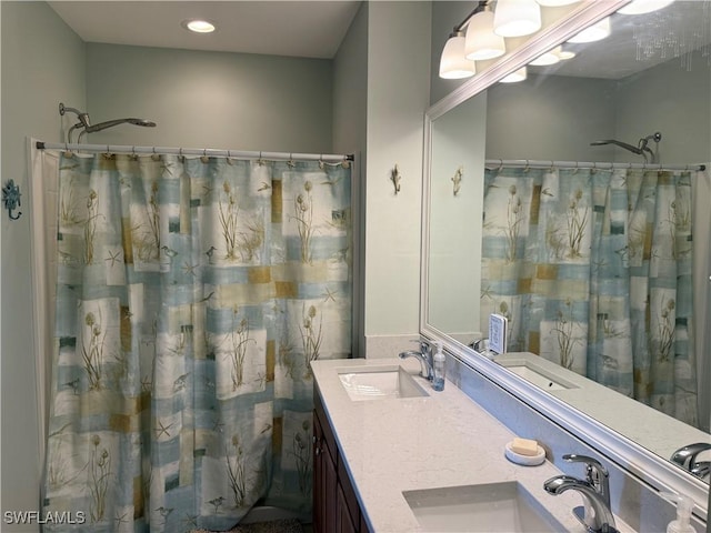 20050 Fiddlewood Ave, North Fort Myers, FL 33917 - full bath with double vanity, a shower with shower curtain, and recessed lighting