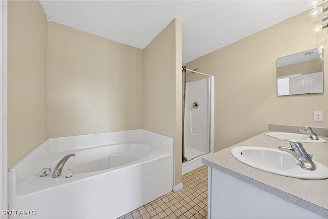 509 Scott Ave, Lehigh Acres, FL 33972 - bathroom featuring a bath, double vanity, a stall shower, and tile patterned flooring