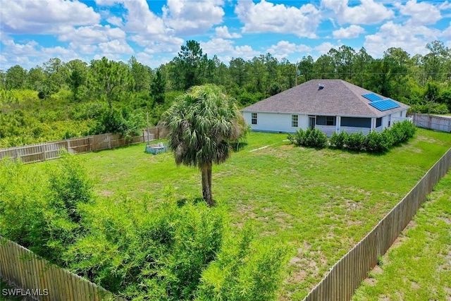 509 Scott Ave, Lehigh Acres, FL 33972 - fenced backyard with a wooded view