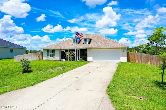 509 Scott Ave, Lehigh Acres, FL 33972 - view of front of house with an attached garage and driveway