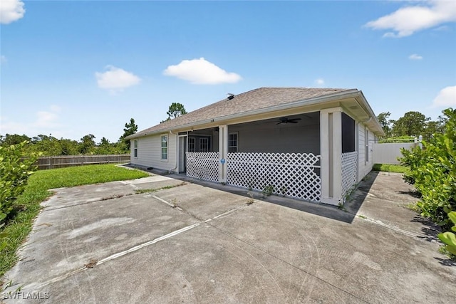 509 Scott Ave, Lehigh Acres, FL 33972 - rear view of house with a fenced backyard, a patio, and a ceiling fan