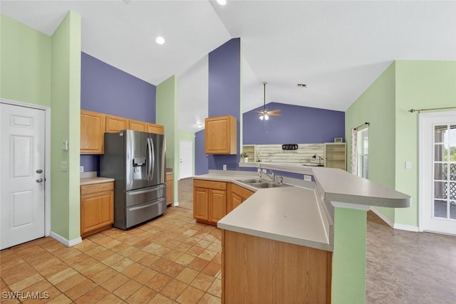 509 Scott Ave, Lehigh Acres, FL 33972 - kitchen featuring stainless steel refrigerator with ice dispenser, a peninsula, high vaulted ceiling, light countertops, and a ceiling fan