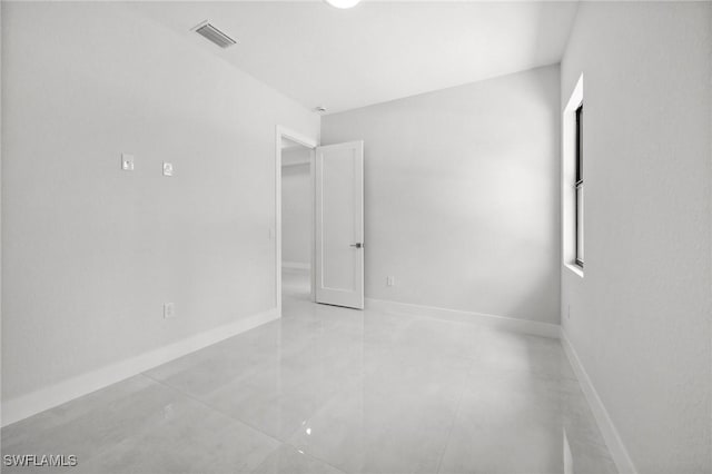 4211 12th Ave NE, Naples, FL 34120 - empty room featuring baseboards