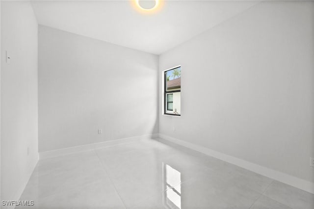 4211 12th Ave NE, Naples, FL 34120 - unfurnished room featuring baseboards and light tile patterned floors
