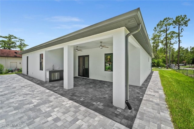 4211 12th Ave NE, Naples, FL 34120 - view of patio featuring a ceiling fan and area for grilling