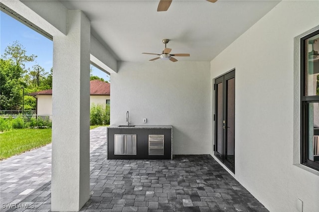 4211 12th Ave NE, Naples, FL 34120 - view of patio with ceiling fan and area for grilling