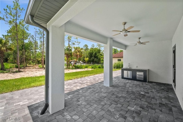 4211 12th Ave NE, Naples, FL 34120 - view of patio / terrace with ceiling fan and area for grilling