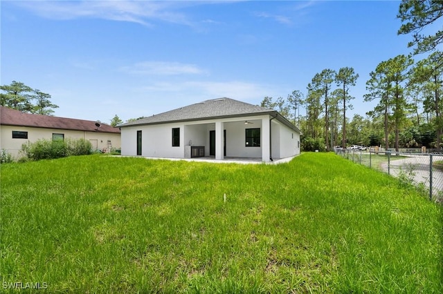 4211 12th Ave NE, Naples, FL 34120 - back of house featuring a ceiling fan, a patio, and stucco siding