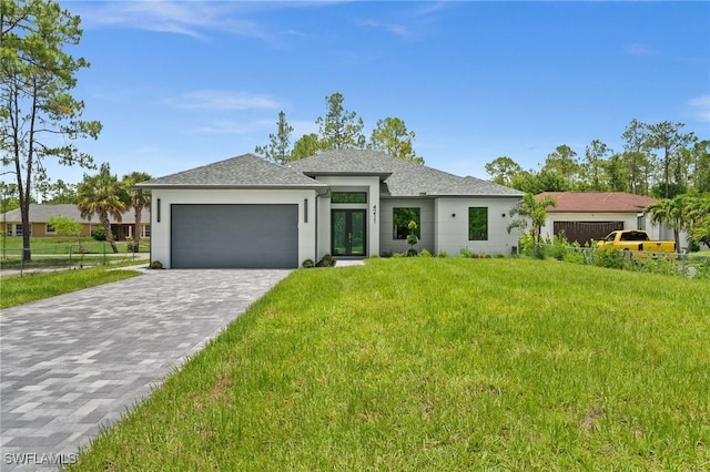 4211 12th Ave NE, Naples, FL 34120 - prairie-style house featuring a garage, french doors, decorative driveway, stucco siding, and roof with shingles