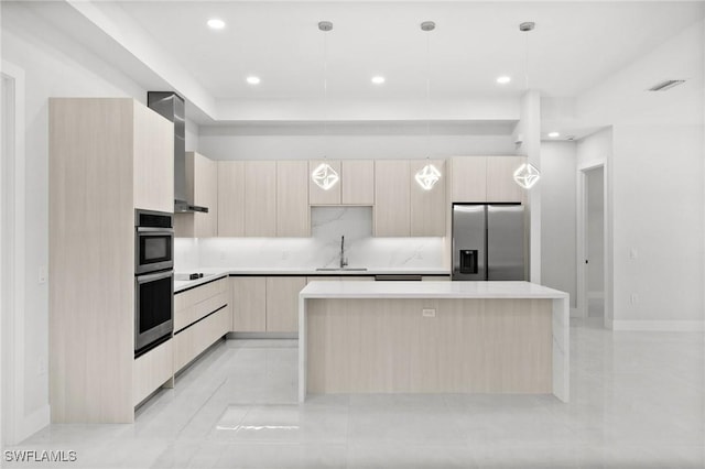 4211 12th Ave NE, Naples, FL 34120 - kitchen with stainless steel appliances, modern cabinets, light brown cabinetry, a kitchen island, and recessed lighting