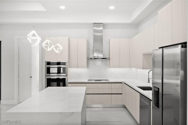 4211 12th Ave NE, Naples, FL 34120 - kitchen featuring appliances with stainless steel finishes, wall chimney range hood, modern cabinets, light stone countertops, and recessed lighting