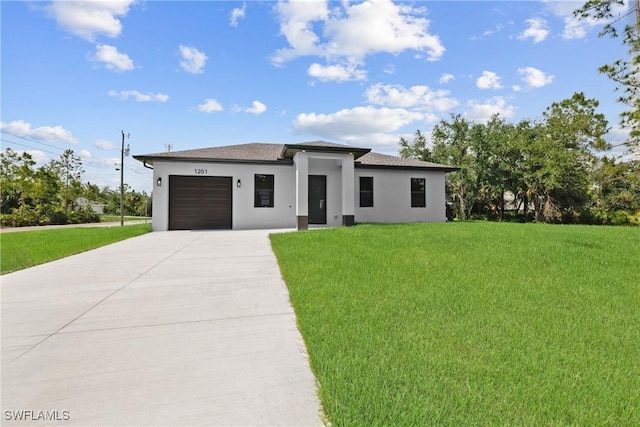1201 E 7th St, Lehigh Acres, FL 33972 - prairie-style home featuring an attached garage, driveway, stucco siding, and a front lawn