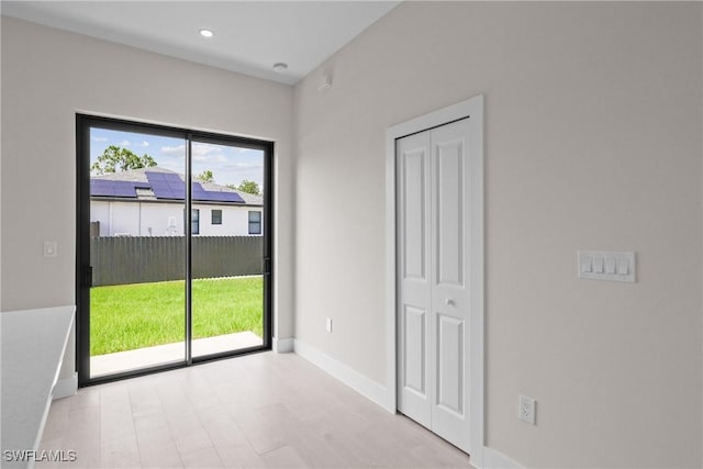 1201 E 7th St, Lehigh Acres, FL 33972 - empty room featuring light wood-style flooring and recessed lighting