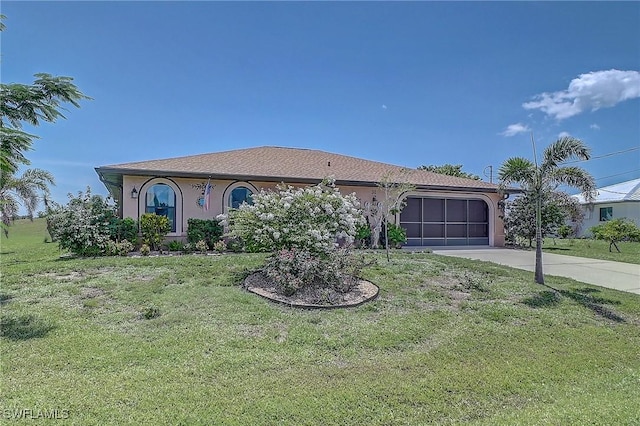 30 Bunker Ln, Rotonda West, FL 33947 - view of front facade featuring concrete driveway, an attached garage, stucco siding, and a front yard