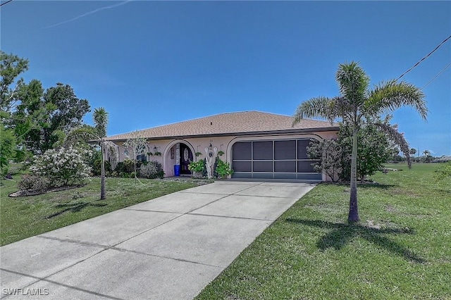 30 Bunker Ln, Rotonda West, FL 33947 - view of front of property with a garage, stucco siding, concrete driveway, and a front lawn