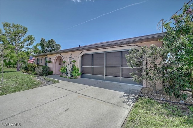 30 Bunker Ln, Rotonda West, FL 33947 - single story home featuring driveway, a garage, stucco siding, and a front yard