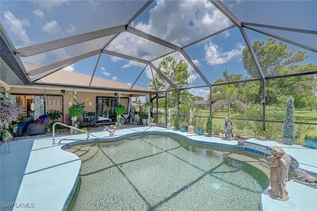 30 Bunker Ln, Rotonda West, FL 33947 - swimming pool featuring a patio area and glass enclosure