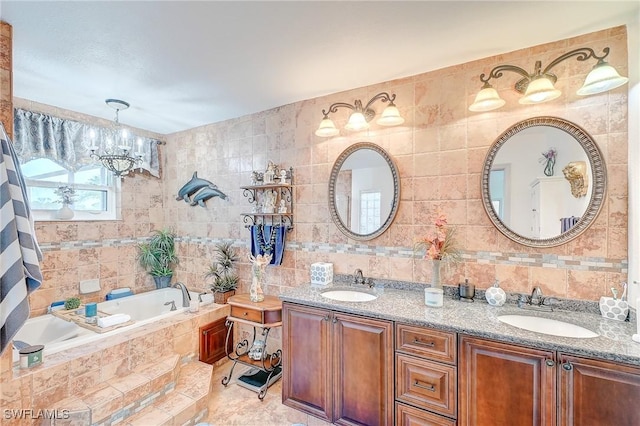 30 Bunker Ln, Rotonda West, FL 33947 - full bathroom featuring tile walls, a chandelier, double vanity, and a garden tub