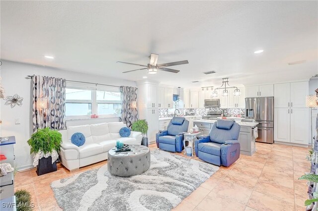 30 Bunker Ln, Rotonda West, FL 33947 - living area with ceiling fan and recessed lighting