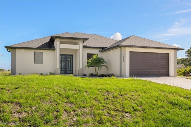 3008 20th St SW, Lehigh Acres, FL 33976 - view of front of home with french doors, stucco siding, a front lawn, an attached garage, and driveway