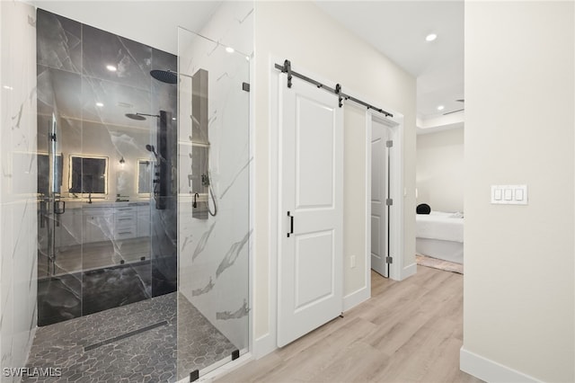 3008 20th St SW, Lehigh Acres, FL 33976 - ensuite bathroom featuring a marble finish shower, wood finished floors, and recessed lighting