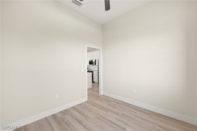 3008 20th St SW, Lehigh Acres, FL 33976 - unfurnished room with a ceiling fan and light wood-type flooring